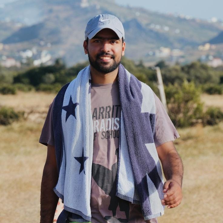 Kaveri Mehta, Lead Design Curator at Future Growth System, reviewing corporate floral arrangements